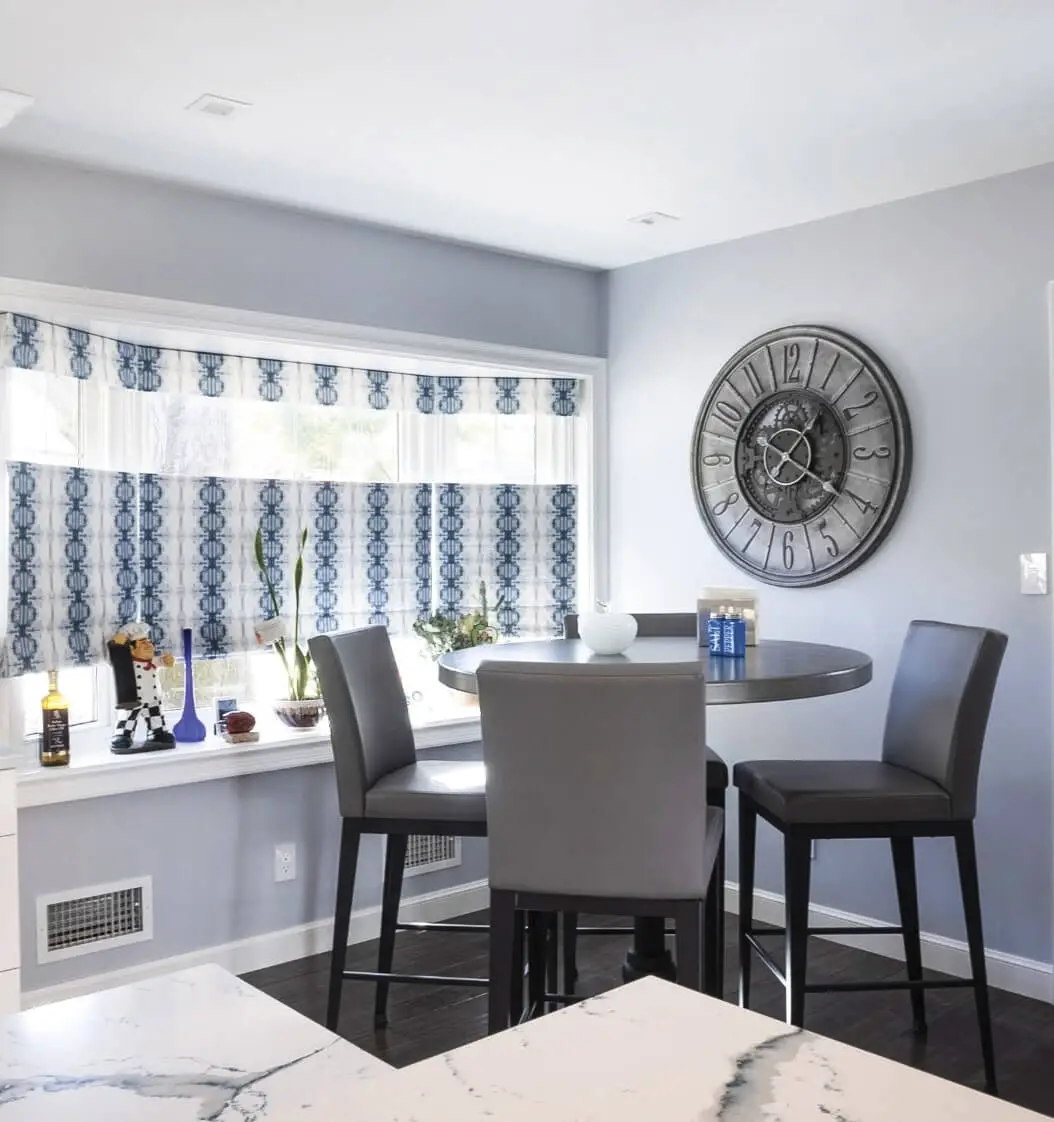 Bright dining area with blue and gray soft furnishings