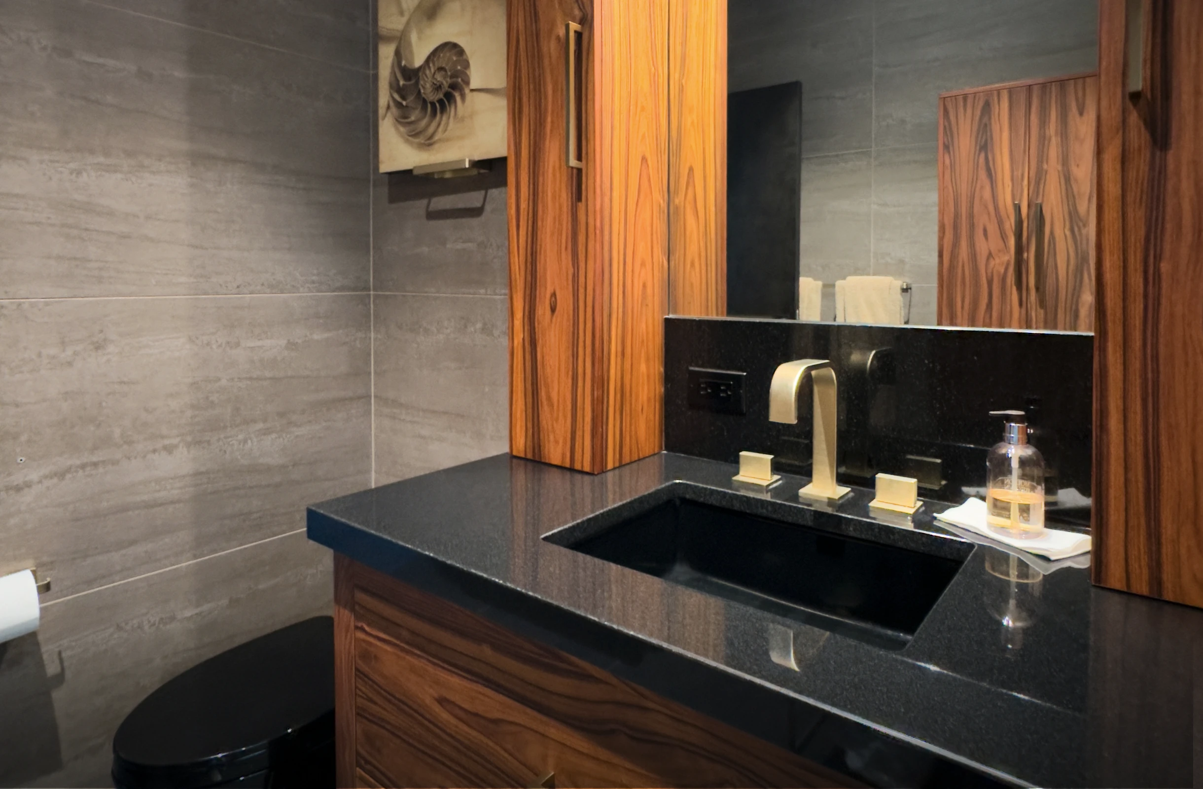 Travertine wall tiles and tall side cabinets